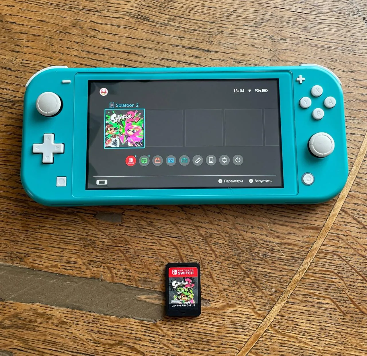 Nintendo Switch Lite бирюзовый с защитным стеклом 1