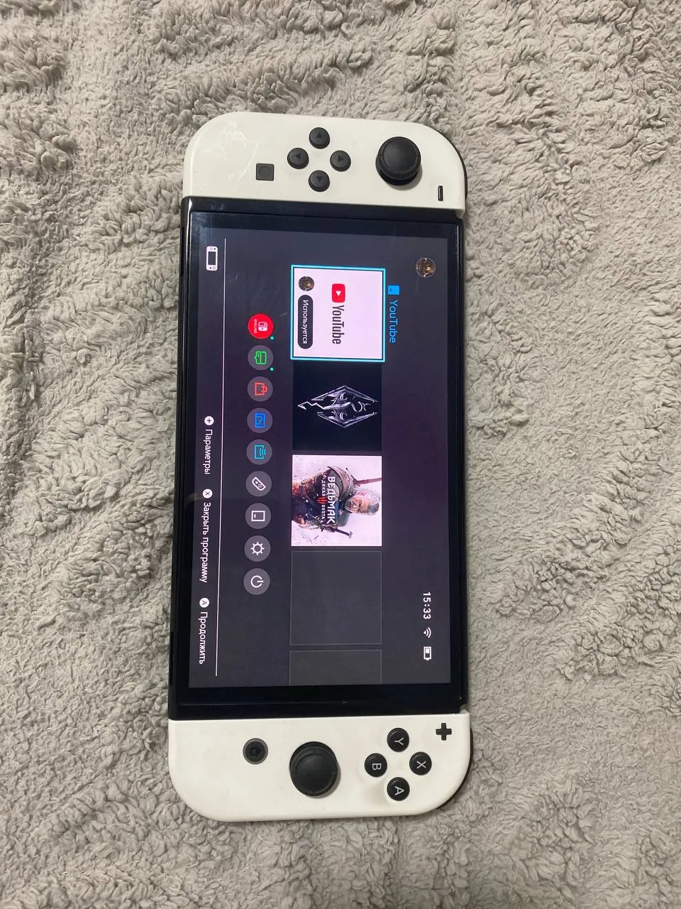Nintendo Switch OLED с играми Skyrim и Ведьмак 3 1
