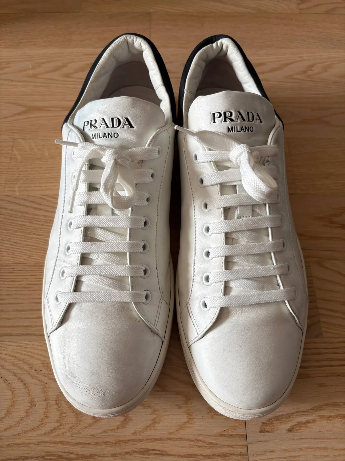 Кроссовки Prada белые кожаные 2