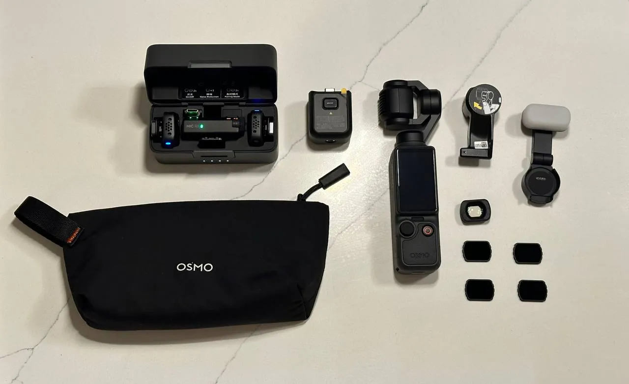 DJI Osmo Pocket 4 с микрофоном и объективом 1